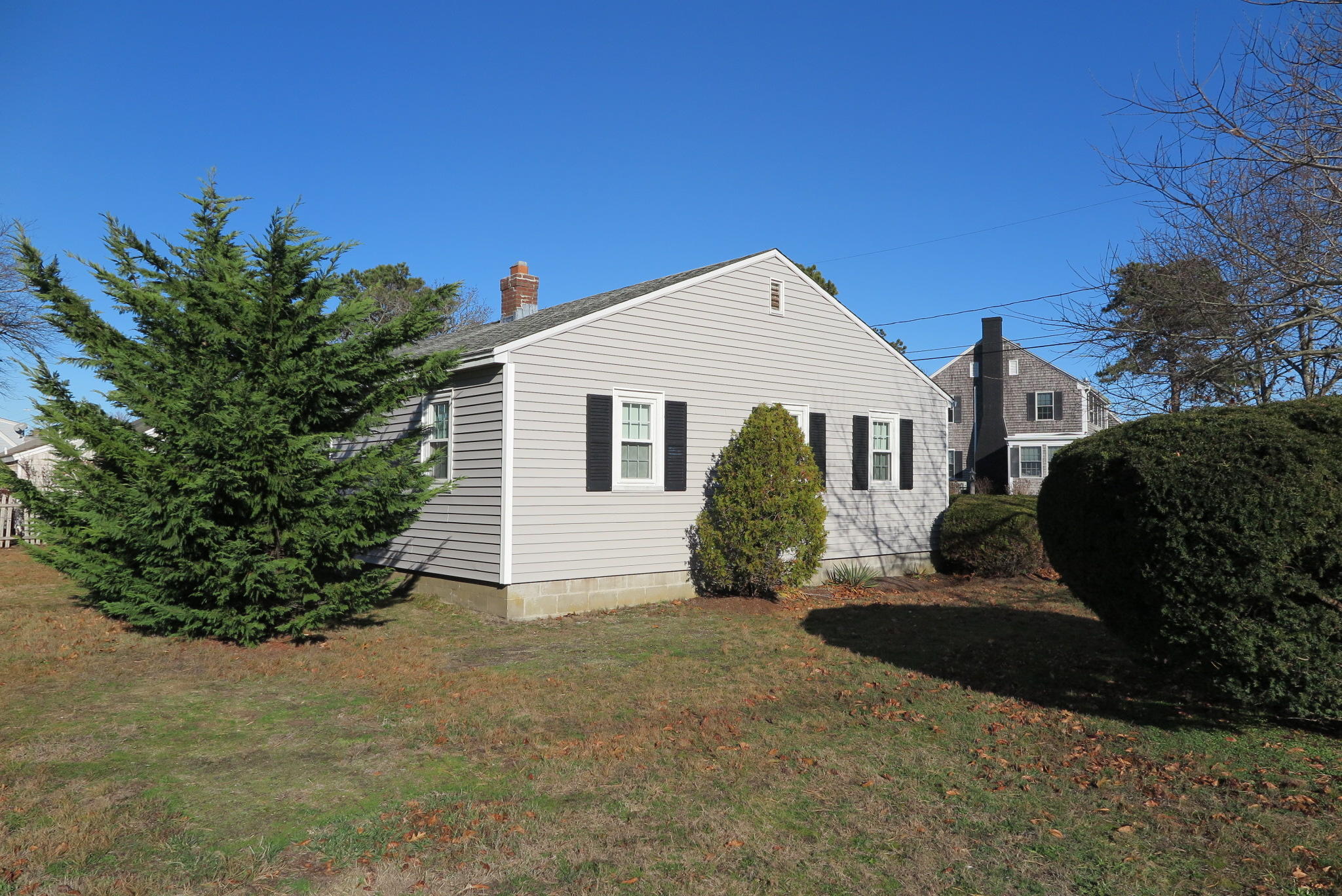 1 Hamilton Road Dennis Port, MA 02639 - Photo 27 of 29 a front view of a house with a garden