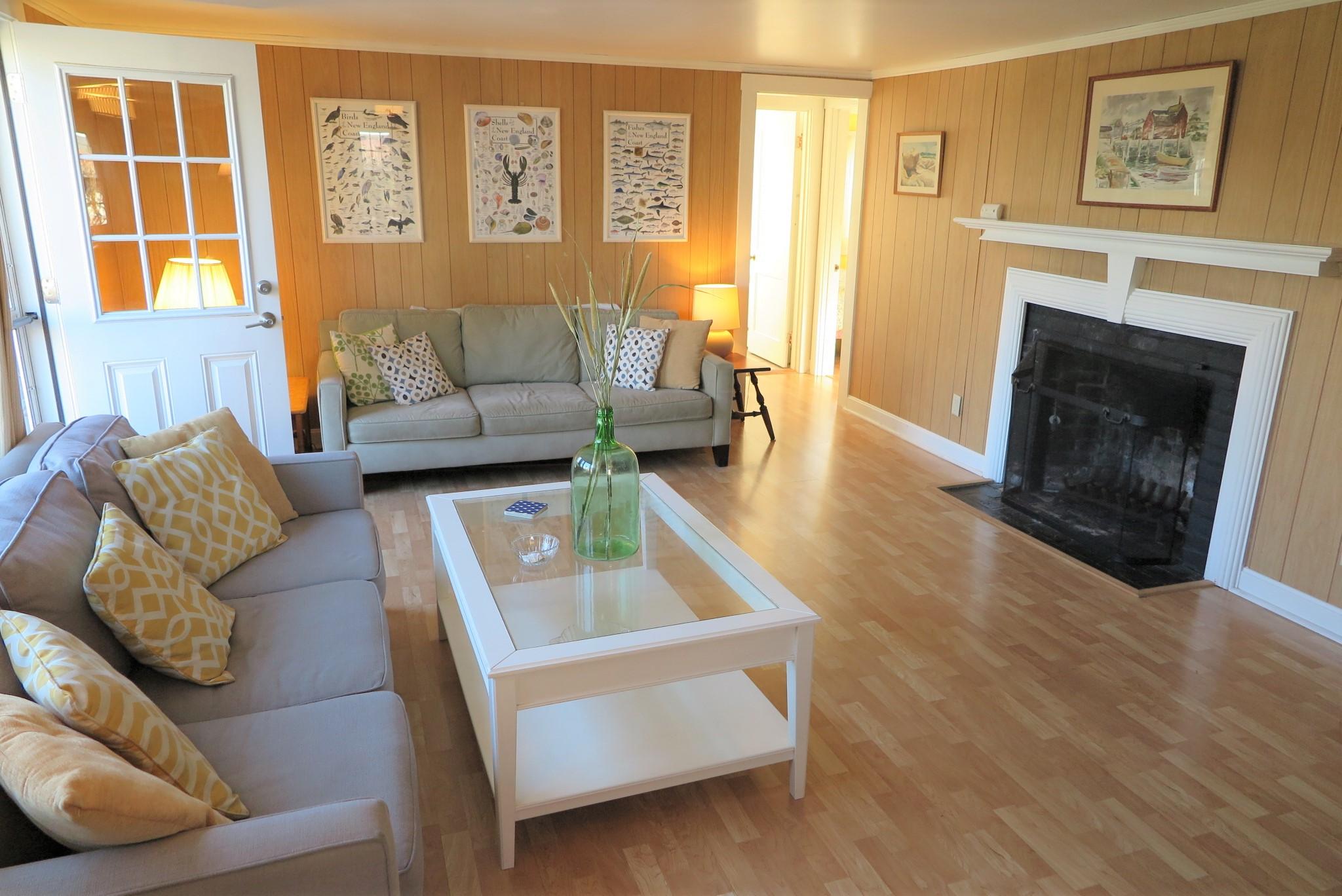 1 Hamilton Road Dennis Port, MA 02639 - Photo 3 of 29 a living room with furniture and a fireplace