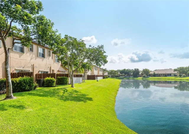 a view of a lake with a house in the background
