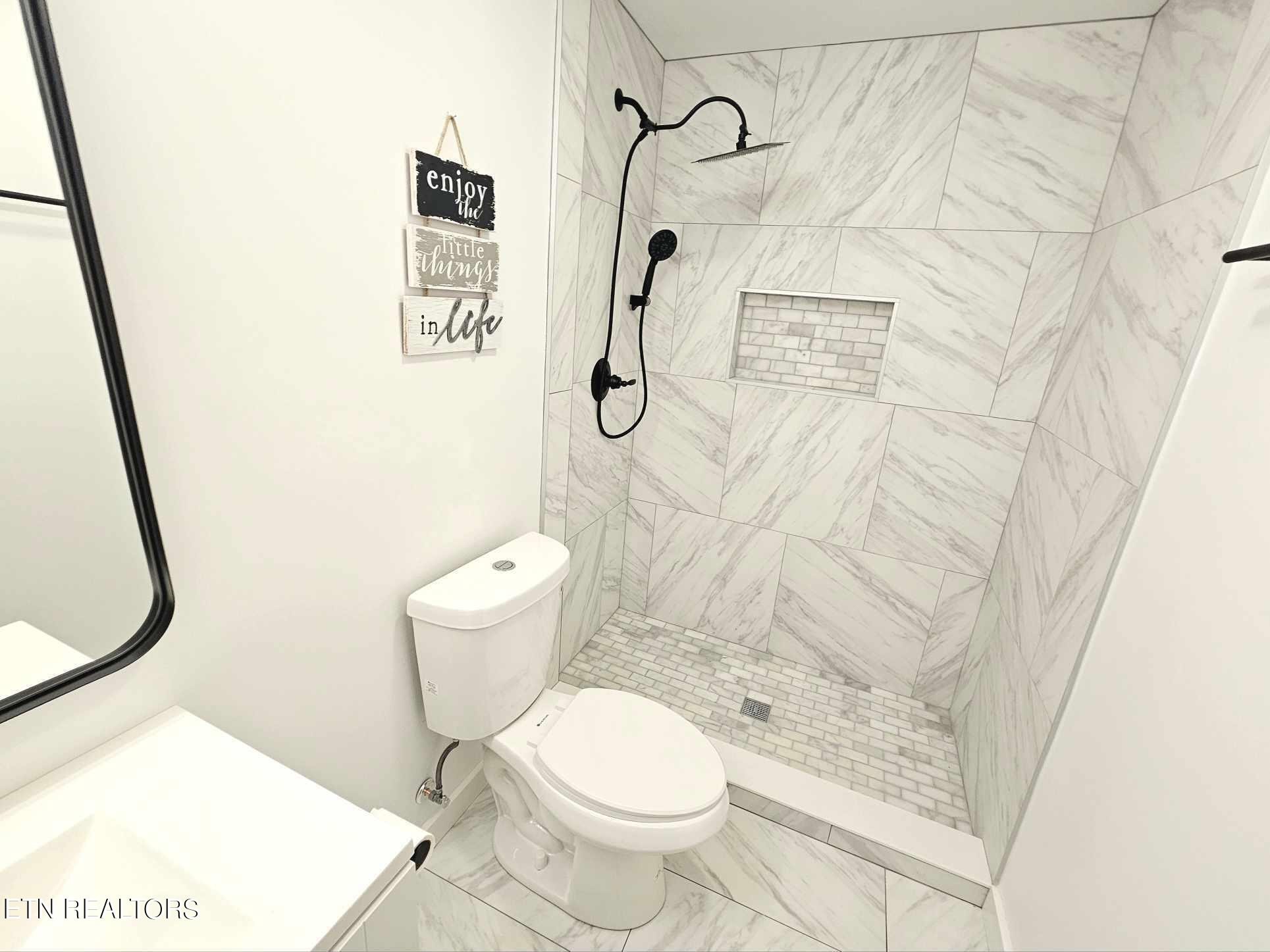 136 Main Road Maryville, TN 37804 - Photo 12 of 24 a bathroom with a toilet and a shower