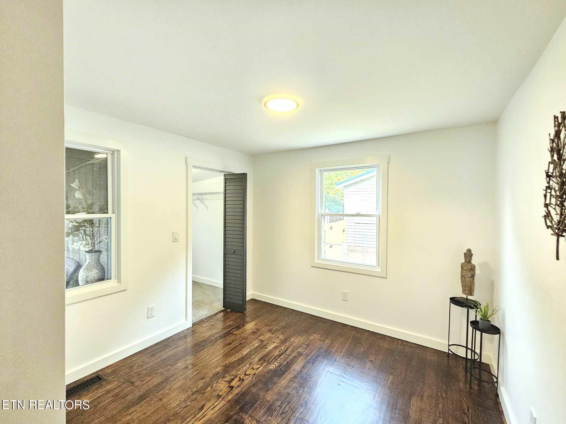 136 Main Road Maryville, TN 37804 - Photo 14 of 24 a view of an empty room with wooden floor and a window