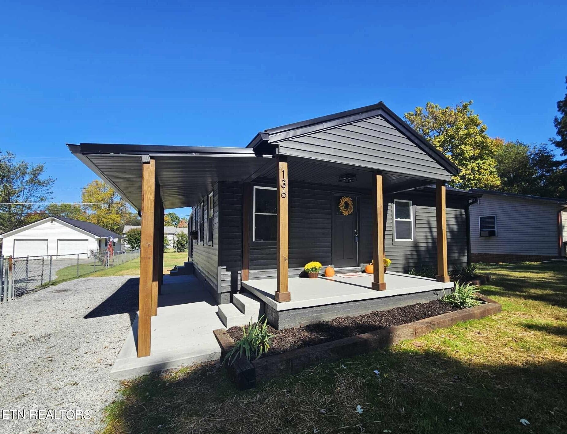 136 Main Road Maryville, TN 37804 - Photo 2 of 24 a view of a house with backyard porch and sitting area