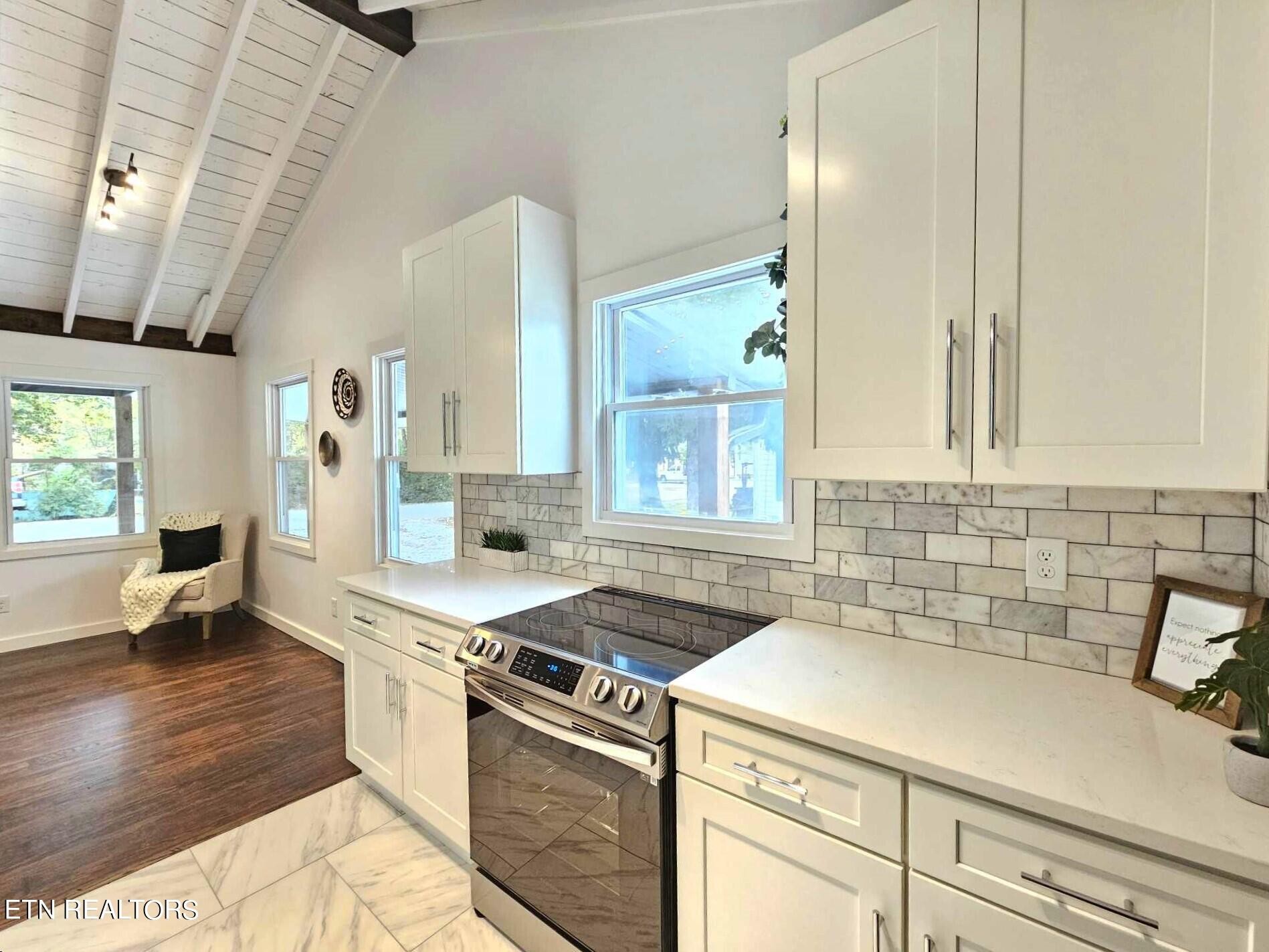 136 Main Road Maryville, TN 37804 - Photo 9 of 24 a kitchen that has a sink and a stove