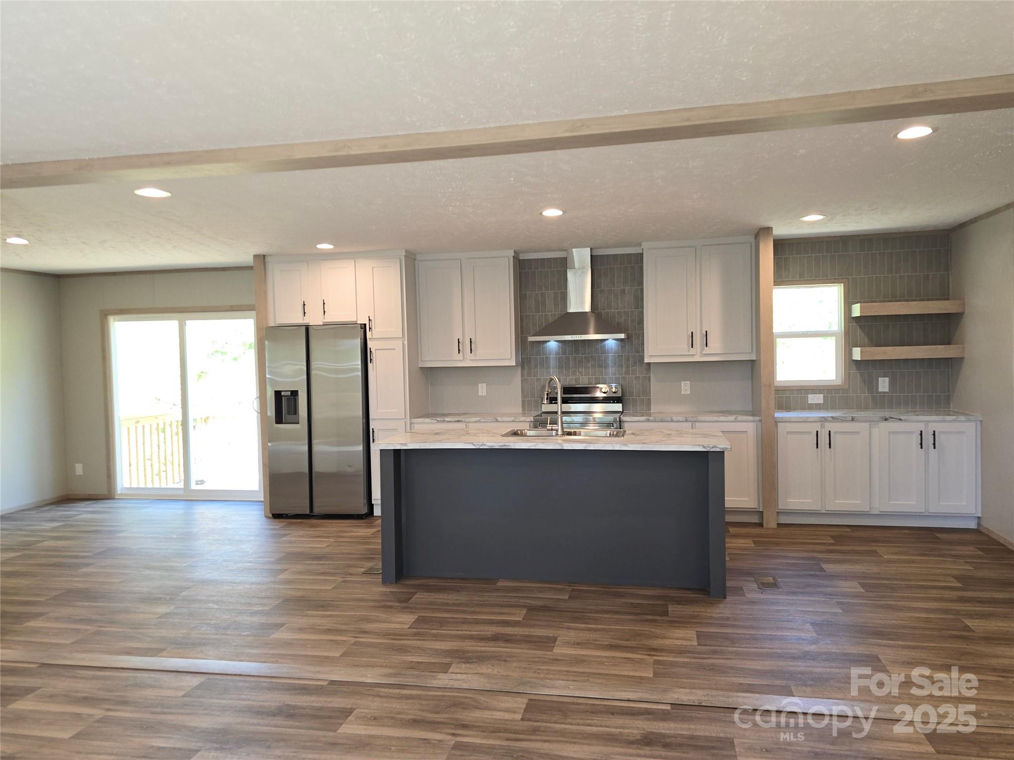 12 McGee Hl Road Fairview, NC 28730 - Photo 8 of 25 a view of kitchen with wooden floor