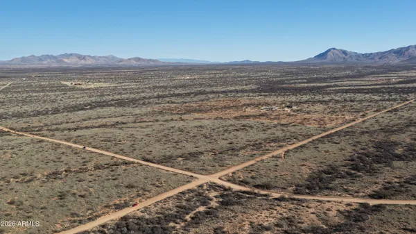 a view of a mountain from a yard