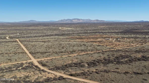 a view of an ocean beach and mountain