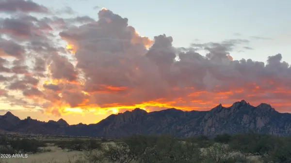 a view of mountain and sunset
