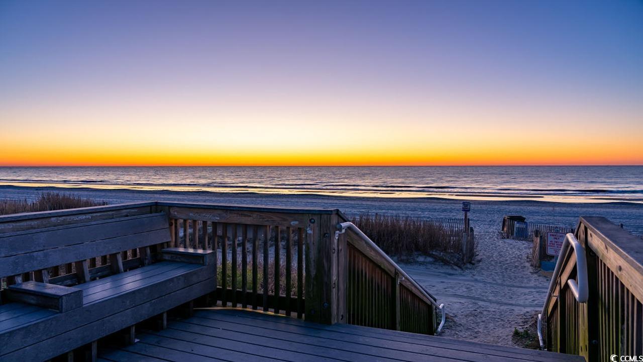 5119 Yellowstone Drive Conway, SC 29526 - Photo 38 of 39 Deck at dusk with view of water and beach