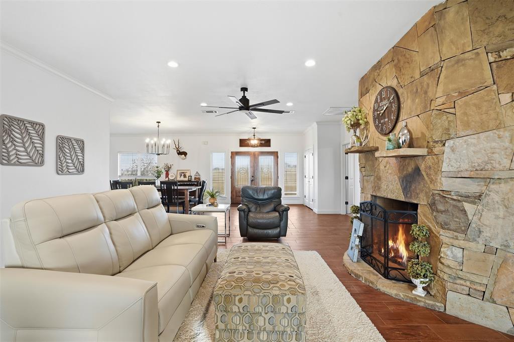2701 County Road 1110 Rio Vista, TX 76093 - Photo 13 of 39 a living room with furniture and wooden floor