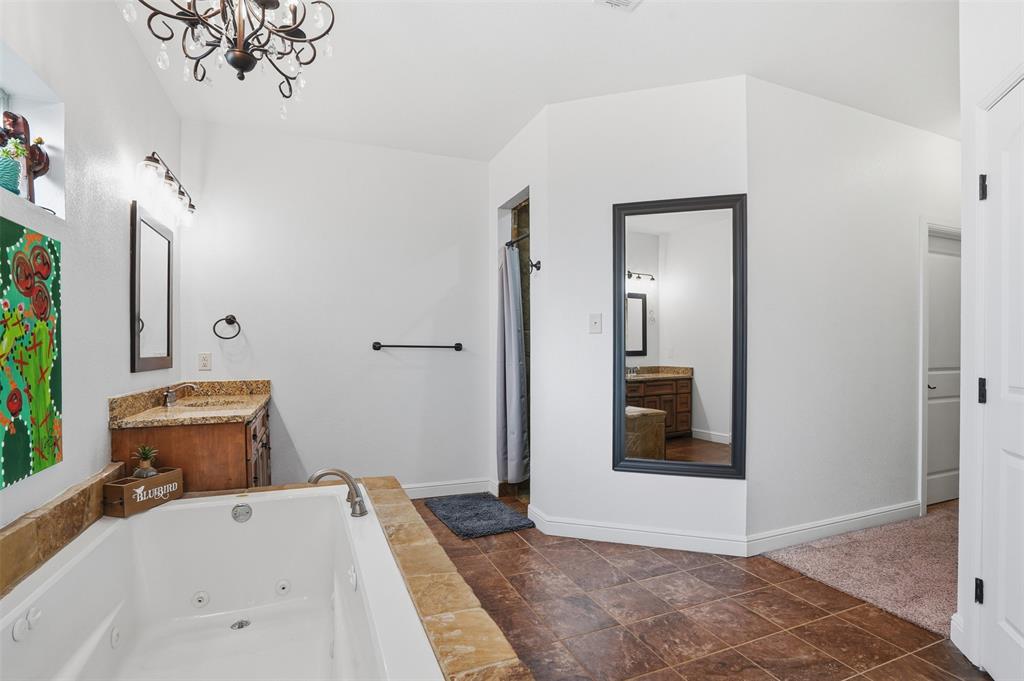 2701 County Road 1110 Rio Vista, TX 76093 - Photo 23 of 39 a bathroom with a sink and a mirror