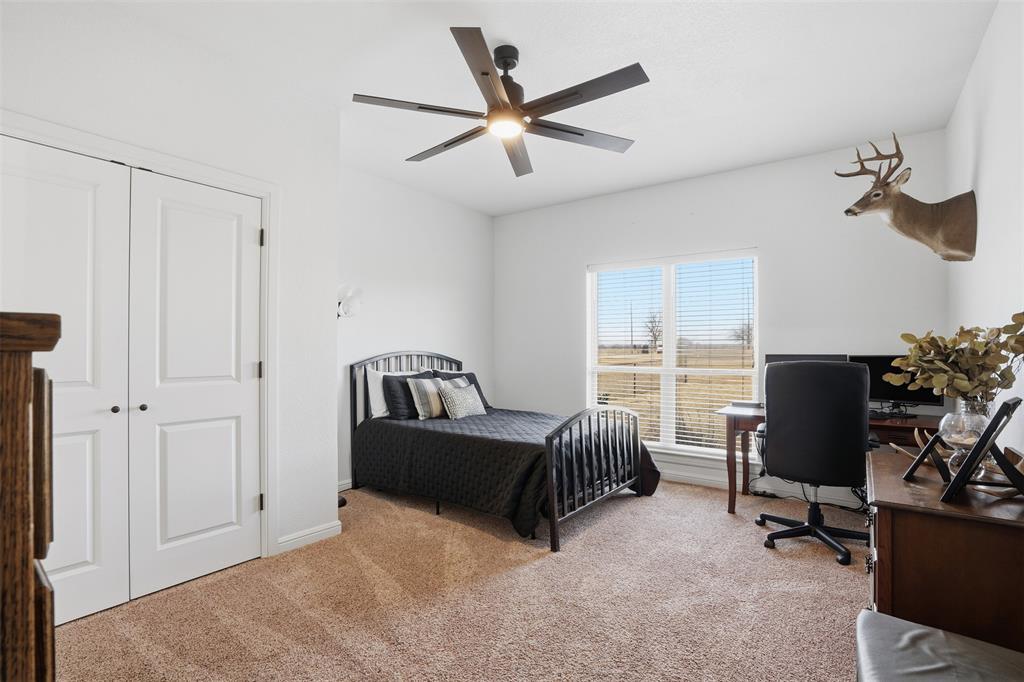 2701 County Road 1110 Rio Vista, TX 76093 - Photo 27 of 39 a bedroom with a bed and a window