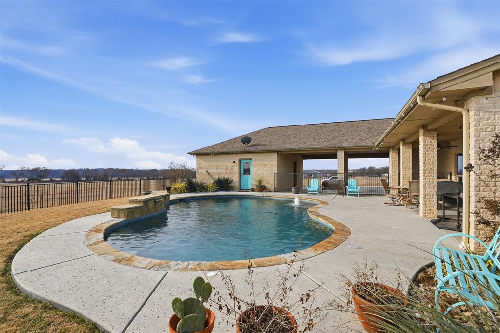 2701 County Road 1110 Rio Vista, TX 76093 - Photo 36 of 39 swimming pool view with a garden space