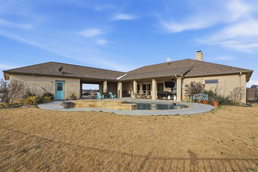 2701 County Road 1110 Rio Vista, TX 76093 - Photo 37 of 39 a view of a house with swimming pool and sitting area