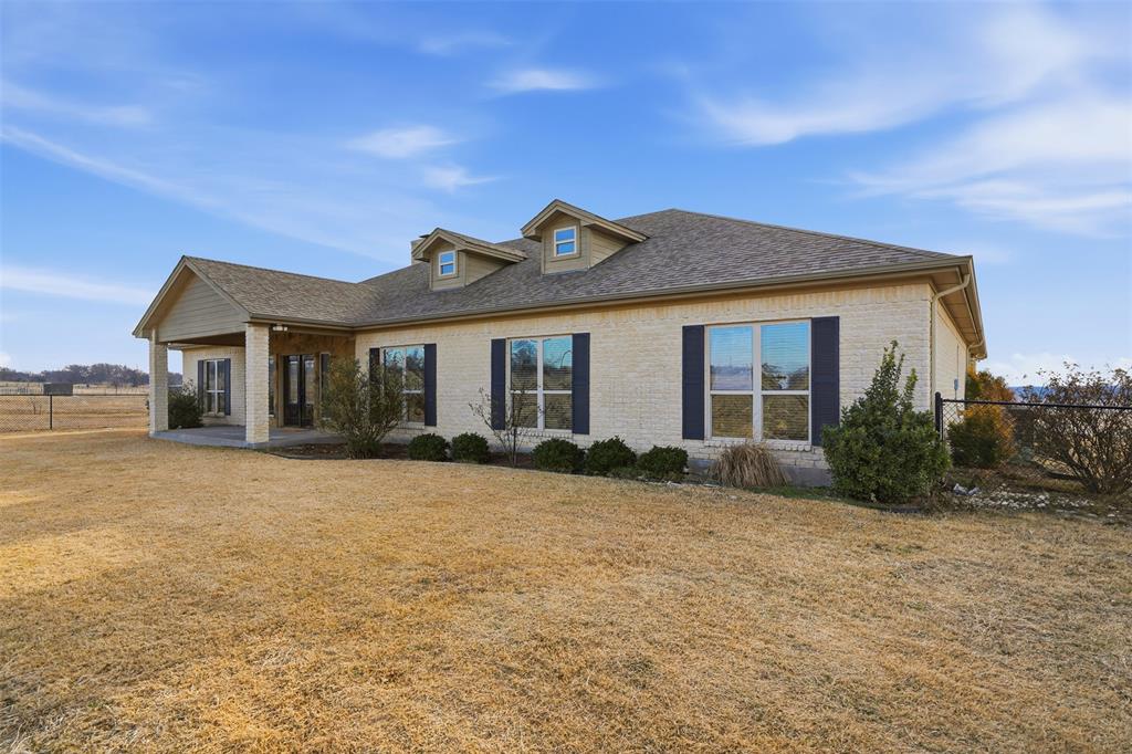 2701 County Road 1110 Rio Vista, TX 76093 - Photo 38 of 39 a front view of a house with a garden