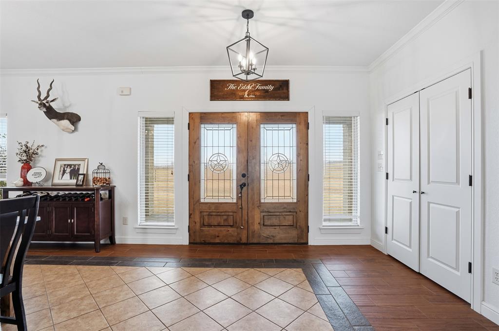2701 County Road 1110 Rio Vista, TX 76093 - Photo 8 of 39 a view of a windows and chandelier in a room