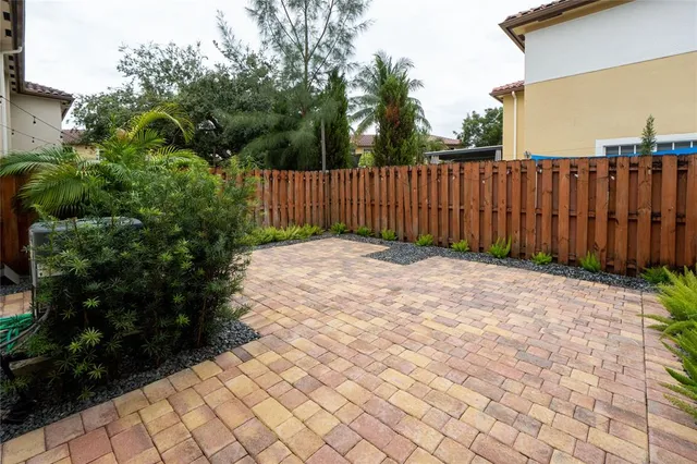 a view of a backyard with pathway