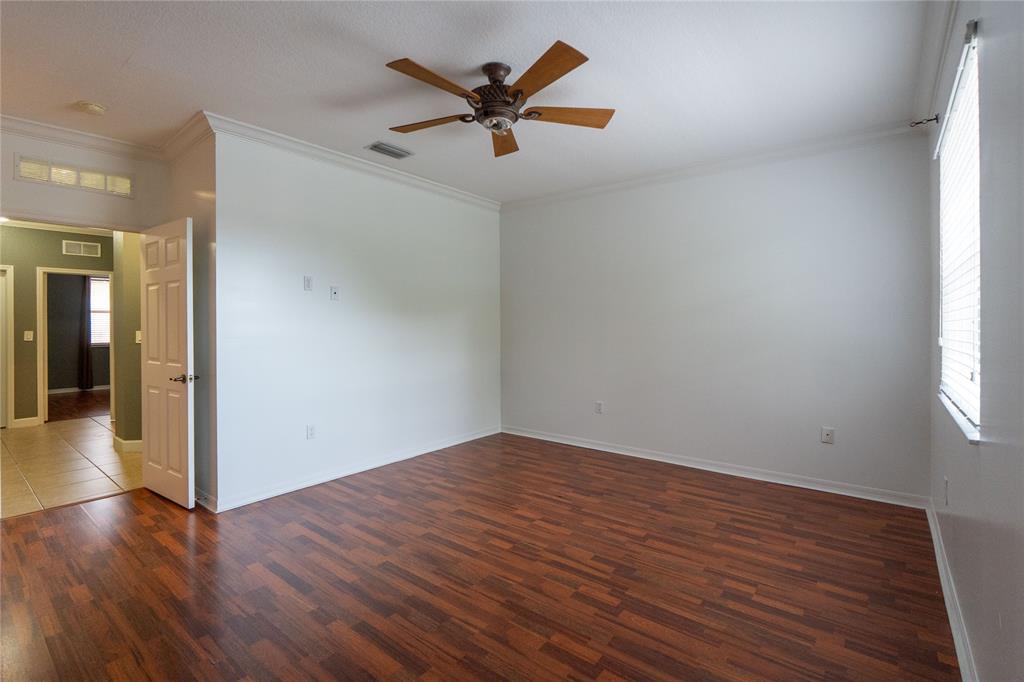 13519 Southwest 50th Court Miramar, FL 33027 - Photo 14 of 26 wooden floor in an empty room with a window