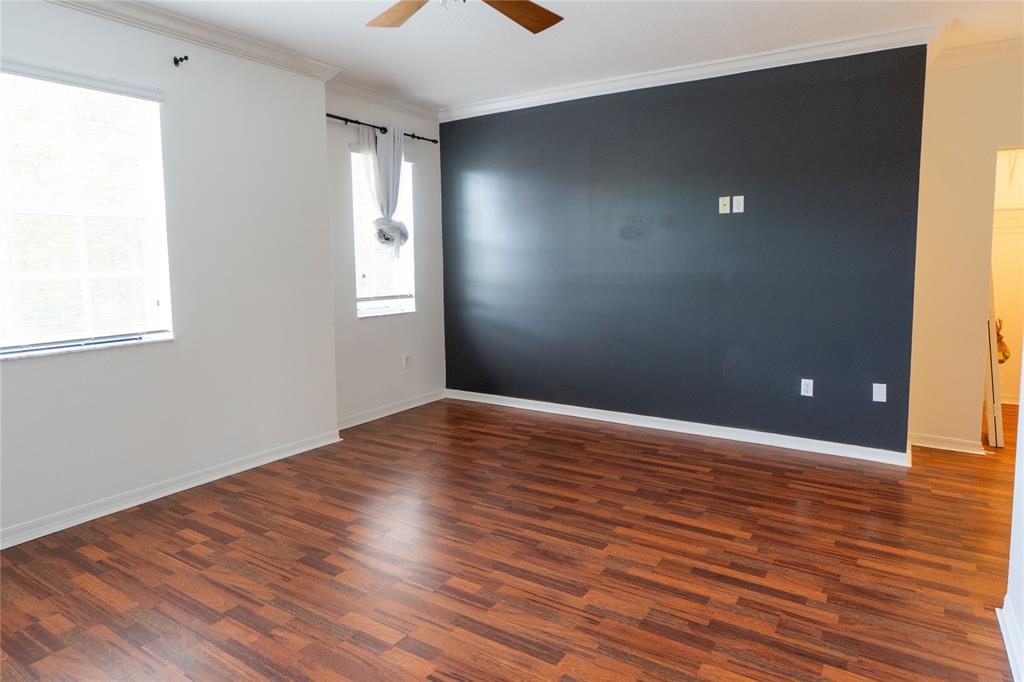 13519 Southwest 50th Court Miramar, FL 33027 - Photo 15 of 26 an empty room with wooden floor and windows