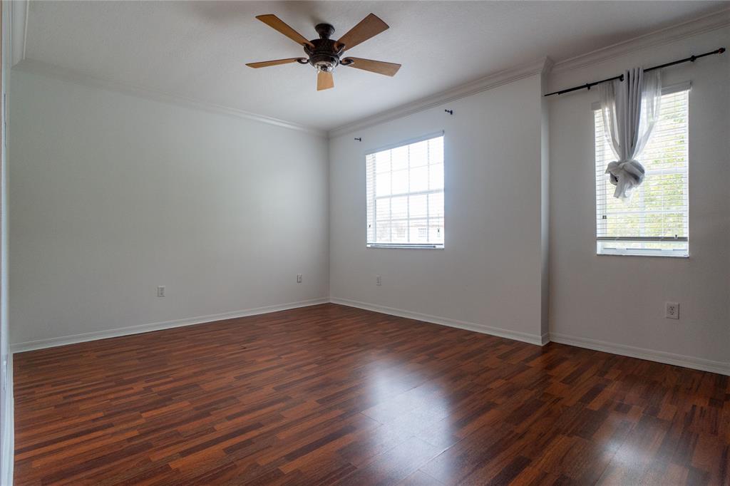 13519 Southwest 50th Court Miramar, FL 33027 - Photo 16 of 26 a view of empty room with wooden floor and fan
