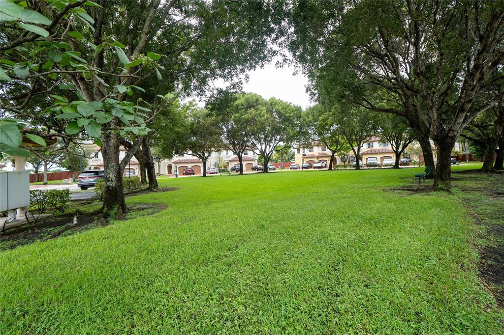 13519 Southwest 50th Court Miramar, FL 33027 - Photo 21 of 26 a view of grassy field with benches and trees all around