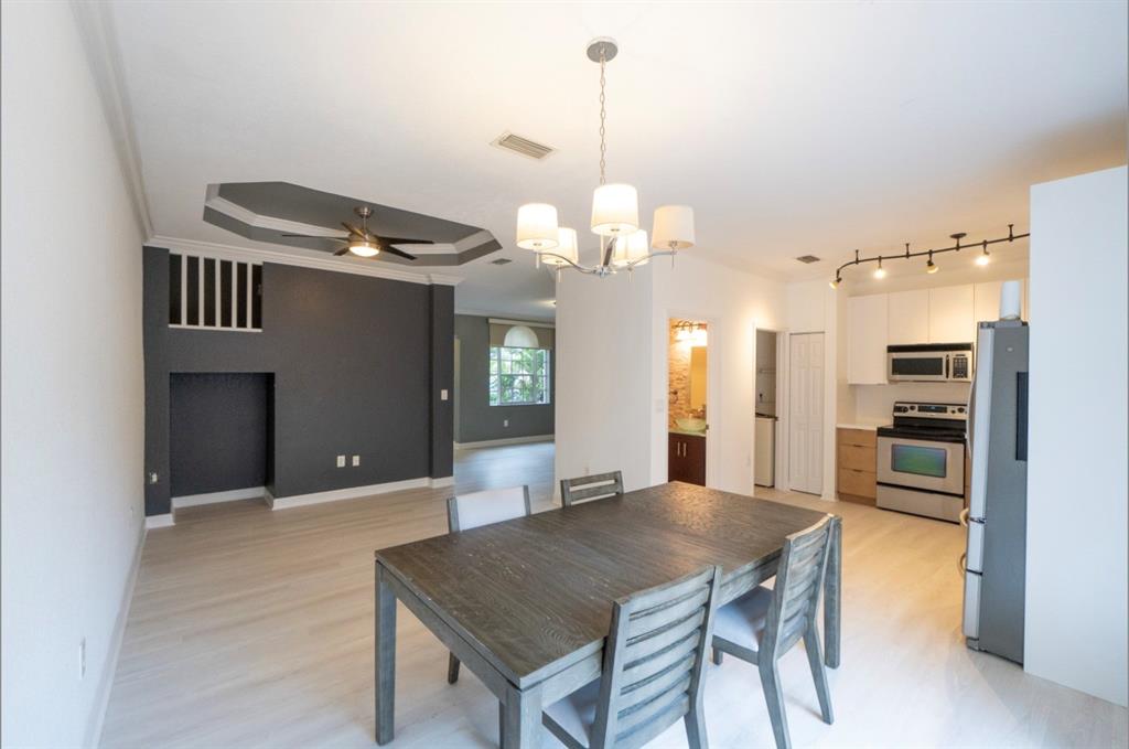 13519 Southwest 50th Court Miramar, FL 33027 - Photo 8 of 26 a view of a dining room with furniture and chandelier