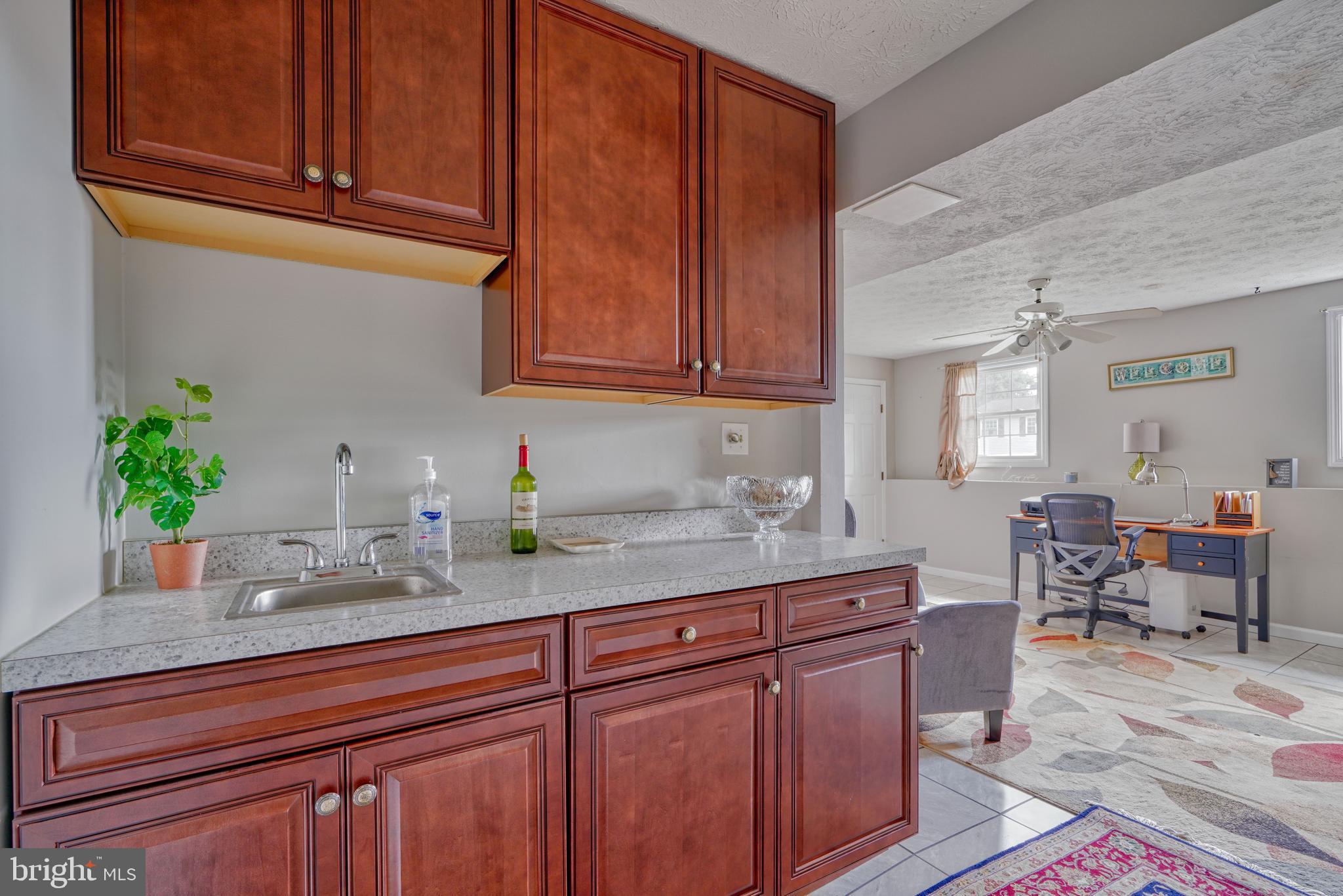 9302 Orbitan Road Parkville, MD 21234 - Photo 30 of 41 Wet bar/counter and cabinets updated