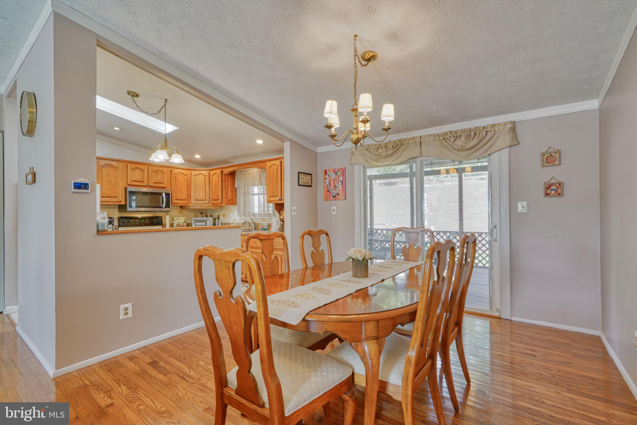 9302 Orbitan Road Parkville, MD 21234 - Photo 10 of 41 Dining room leads to screened in porch