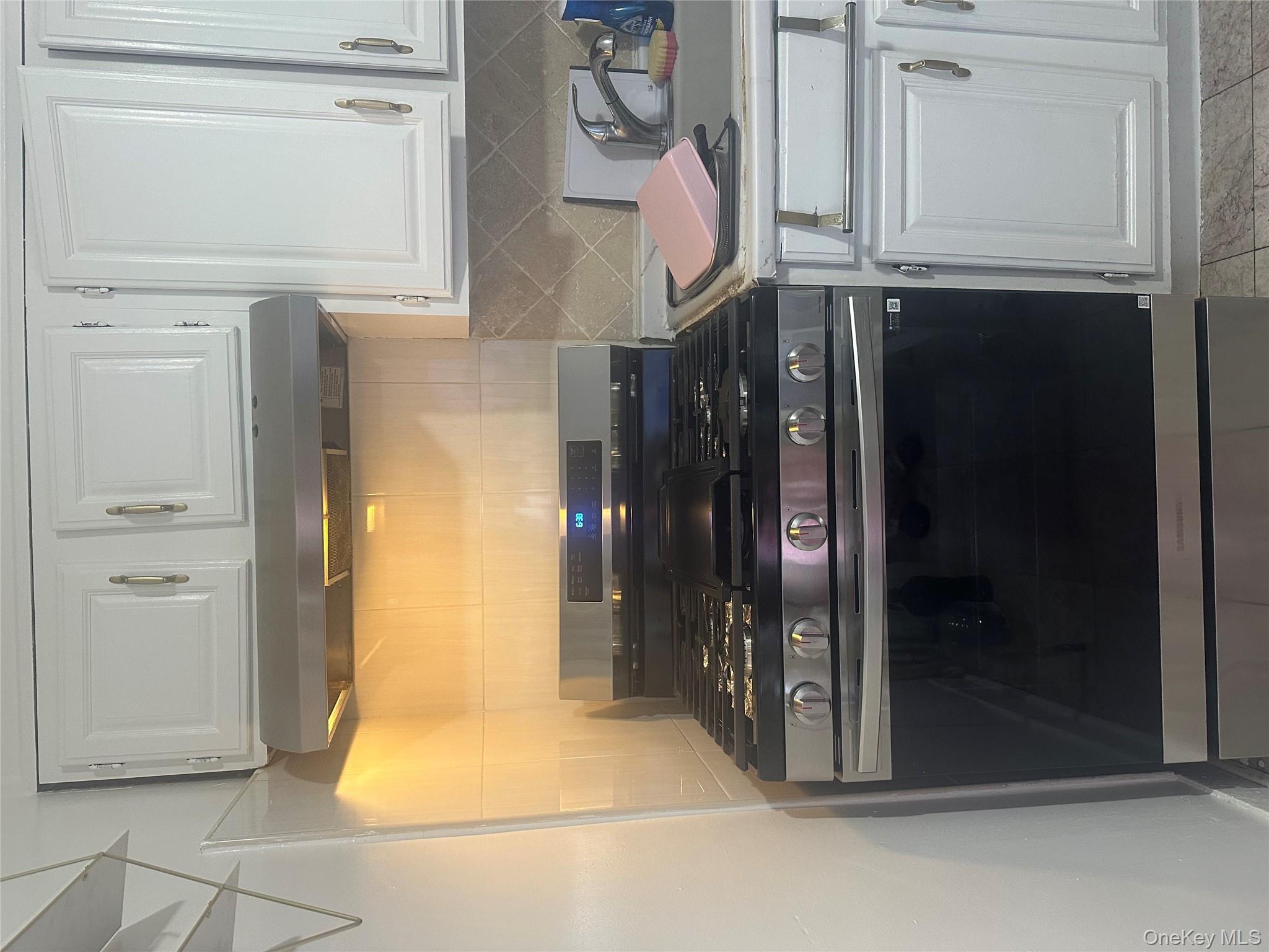 21 Drake Avenue New Rochelle, NY 10805 - Photo 11 of 18 a stove top oven sitting inside of a kitchen