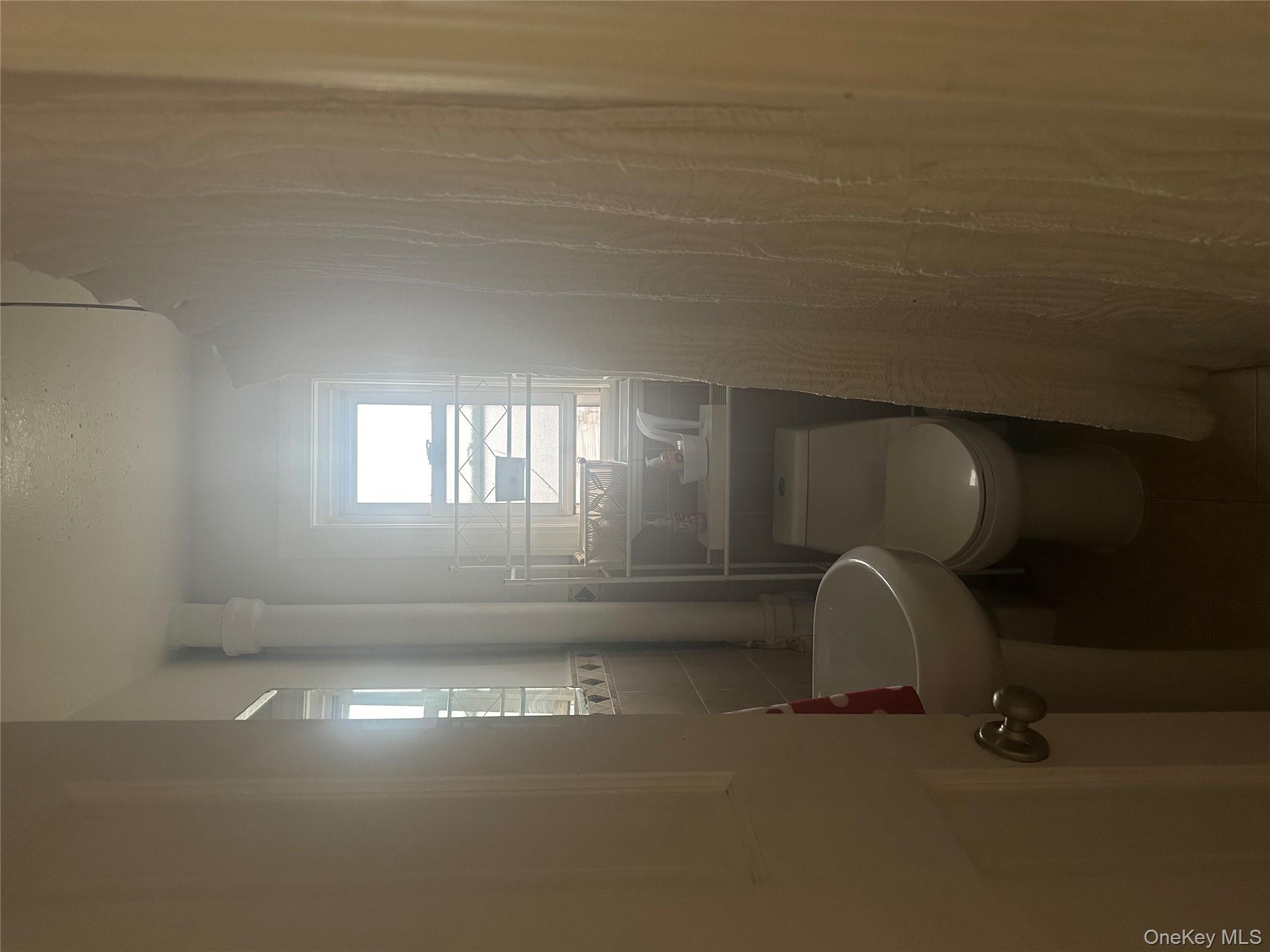 21 Drake Avenue New Rochelle, NY 10805 - Photo 12 of 18 a bathroom with a sink and toilet