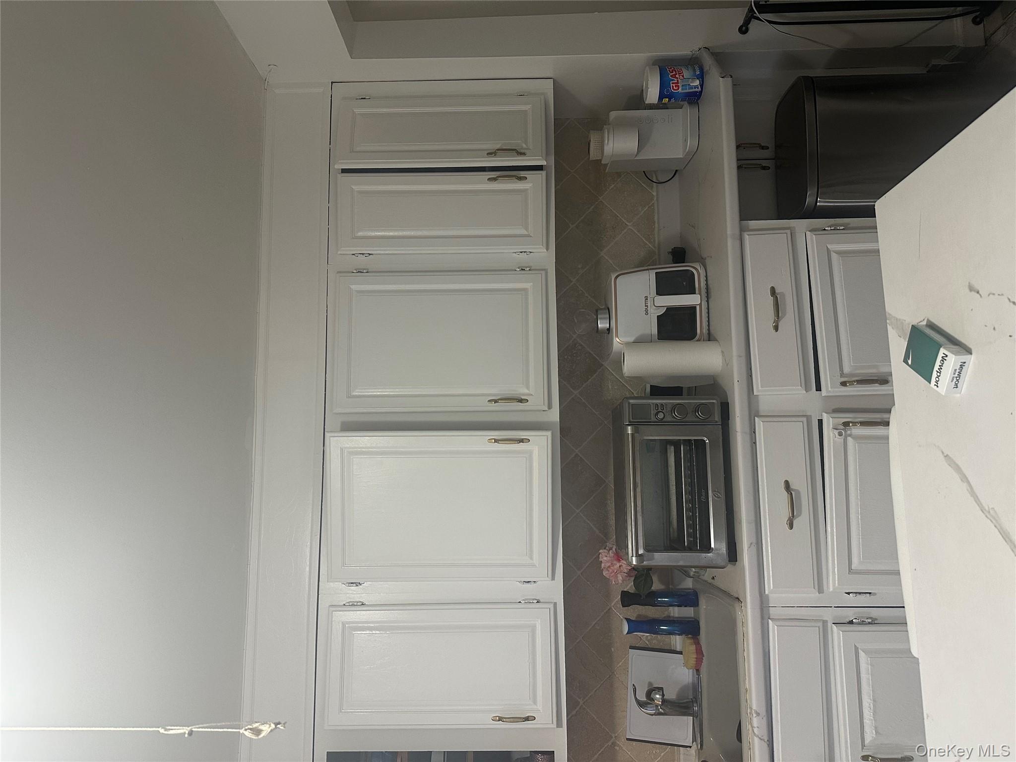 21 Drake Avenue New Rochelle, NY 10805 - Photo 14 of 18 a view of kitchen with white cabinets