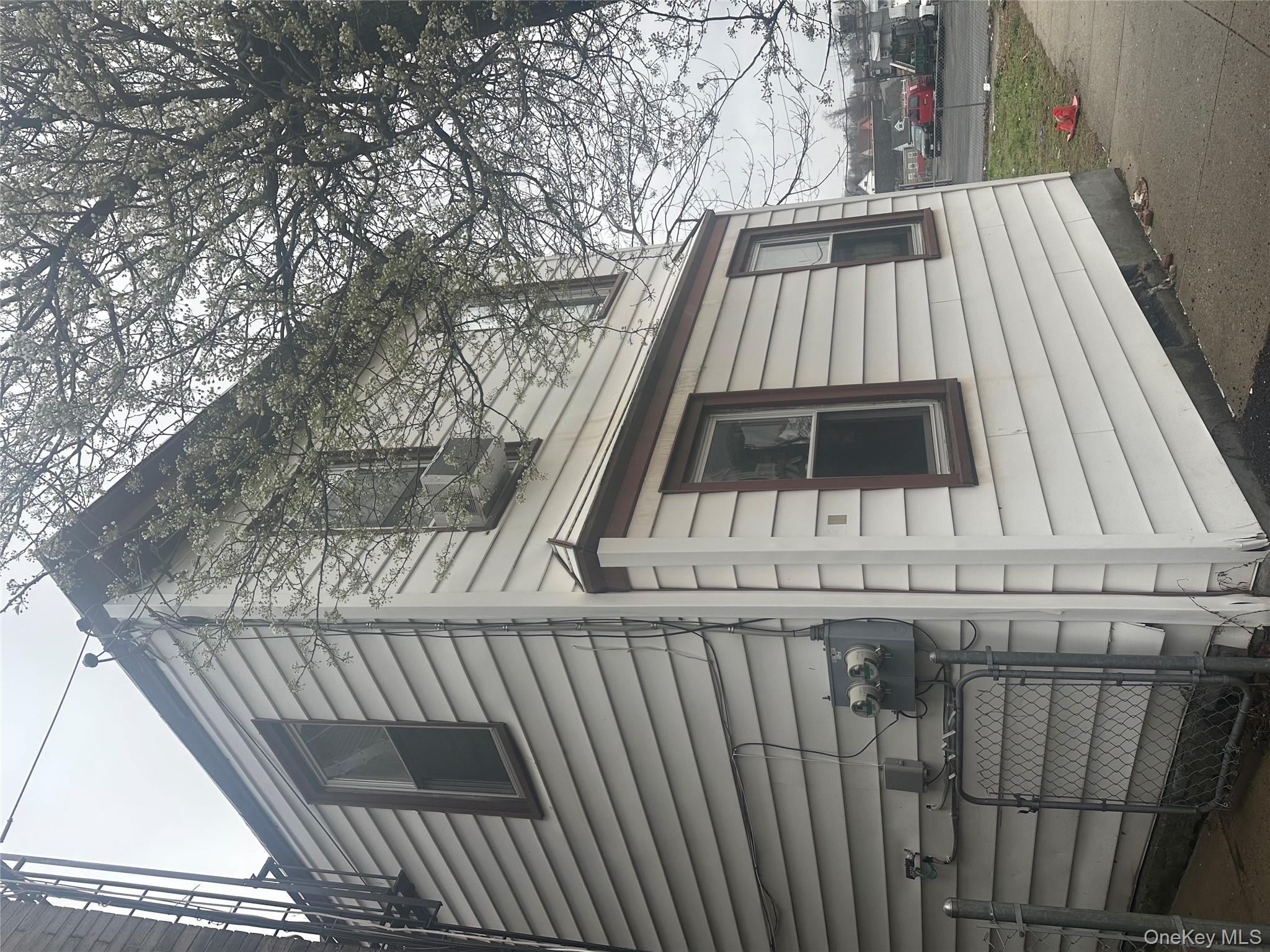 21 Drake Avenue New Rochelle, NY 10805 - Photo 3 of 18 a view of a house with a yard