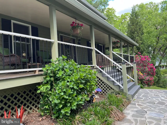 a view of a house with a flower garden