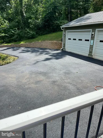 a view of backyard and garage