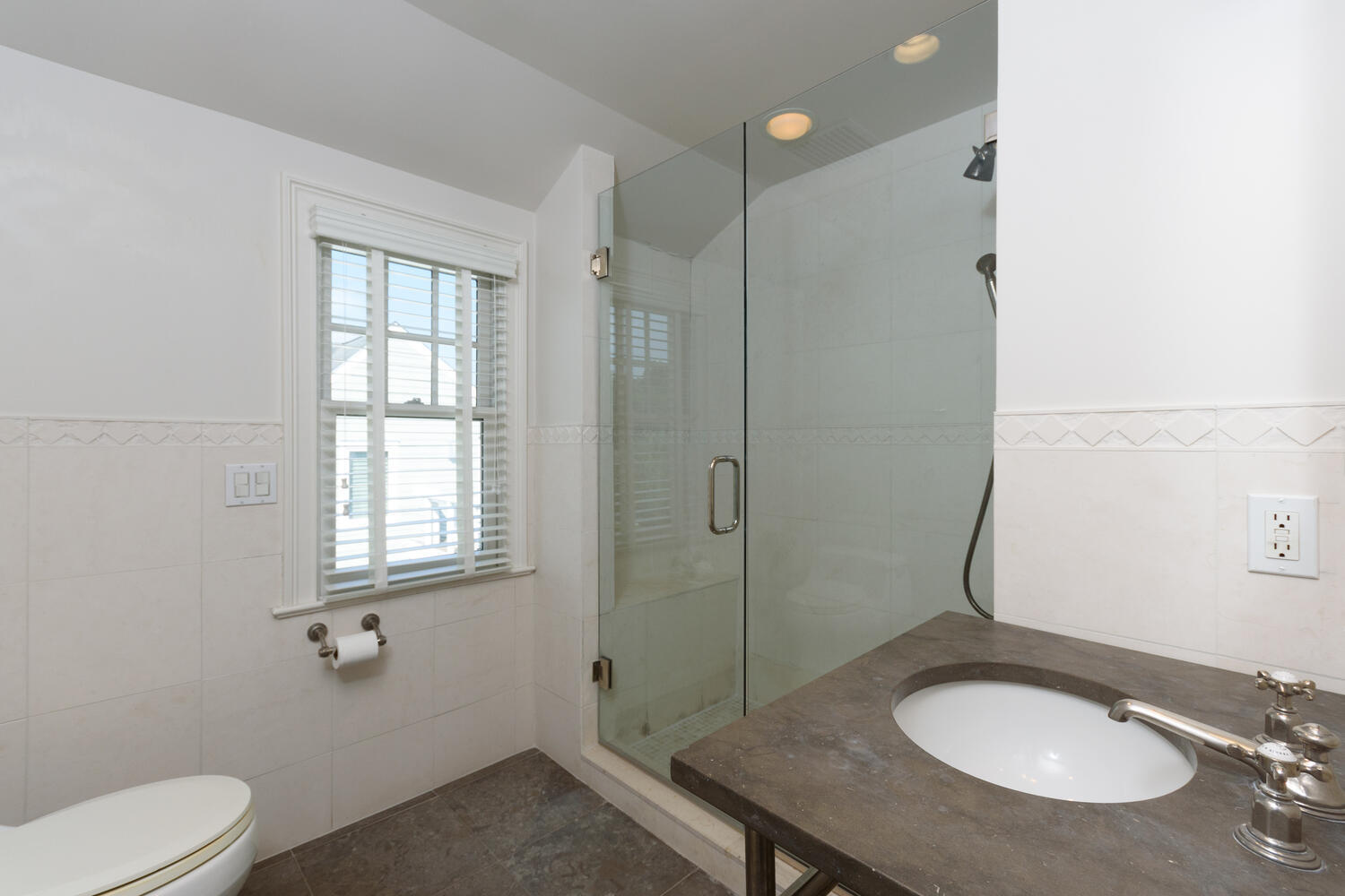 73 Roton Avenue Rowayton, CT 06853 - Photo 21 of 31 a bathroom with a sink toilet a mirror and shower