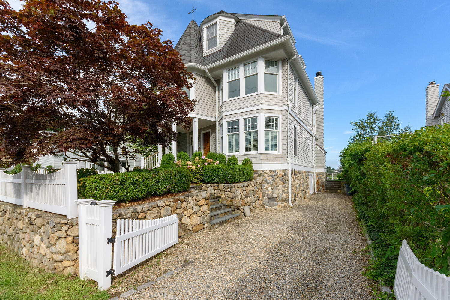 73 Roton Avenue Rowayton, CT 06853 - Photo 3 of 31 a front view of a house with a yard