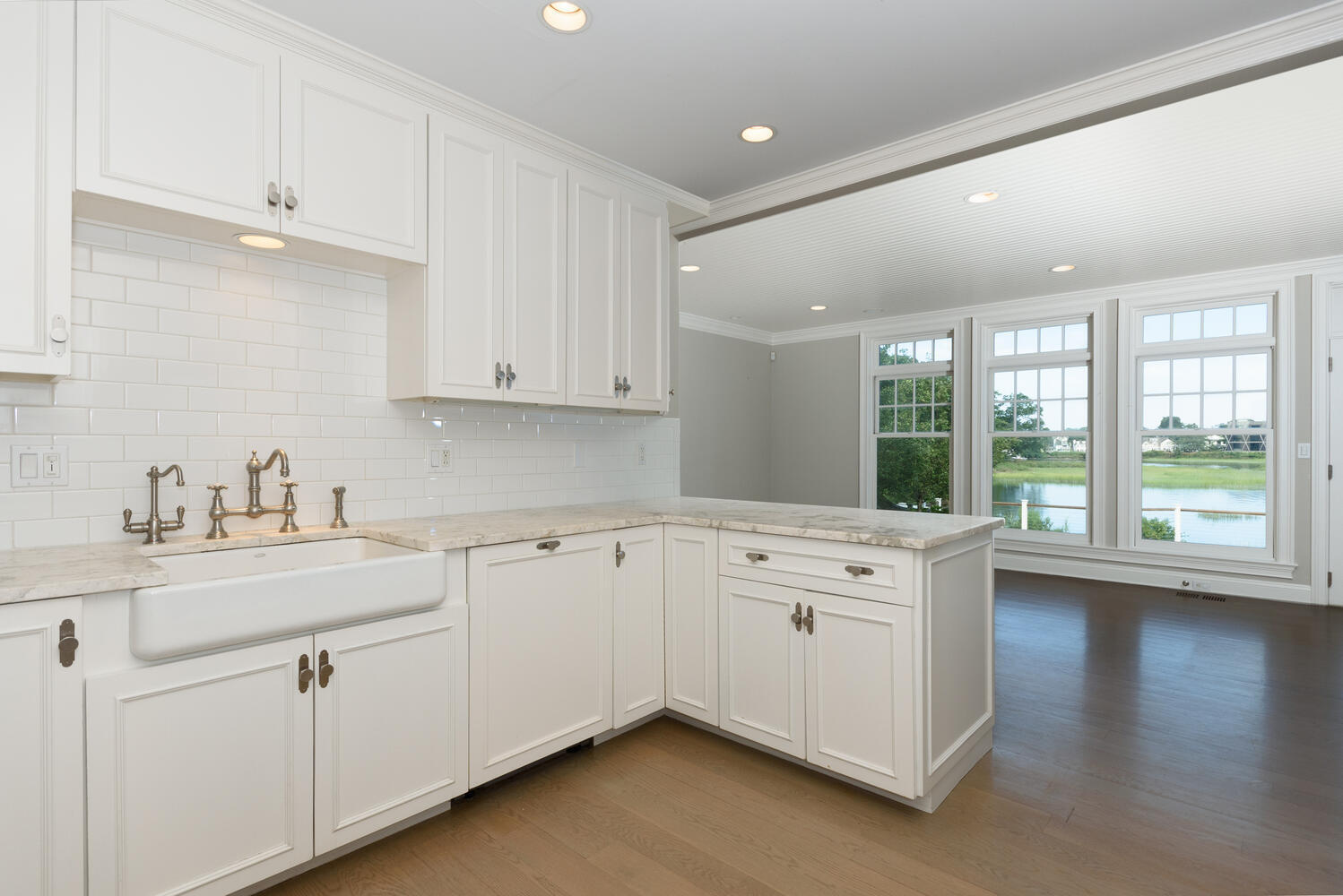 73 Roton Avenue Rowayton, CT 06853 - Photo 7 of 31 a kitchen with granite countertop white cabinets and white appliances