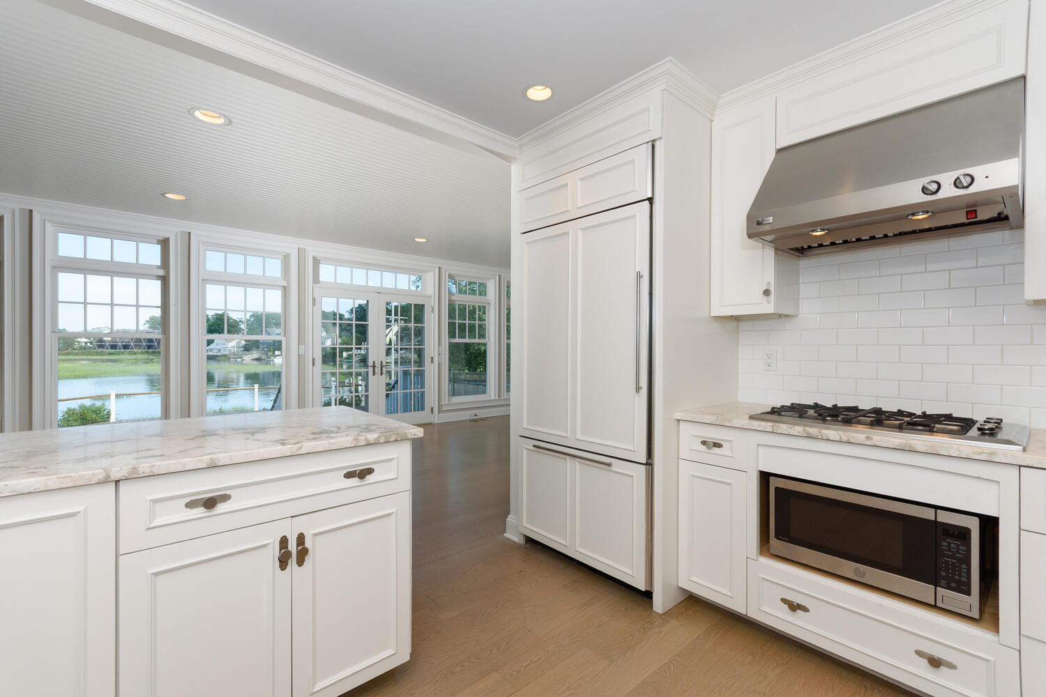 73 Roton Avenue Rowayton, CT 06853 - Photo 8 of 31 a kitchen with granite countertop white cabinets and white appliances
