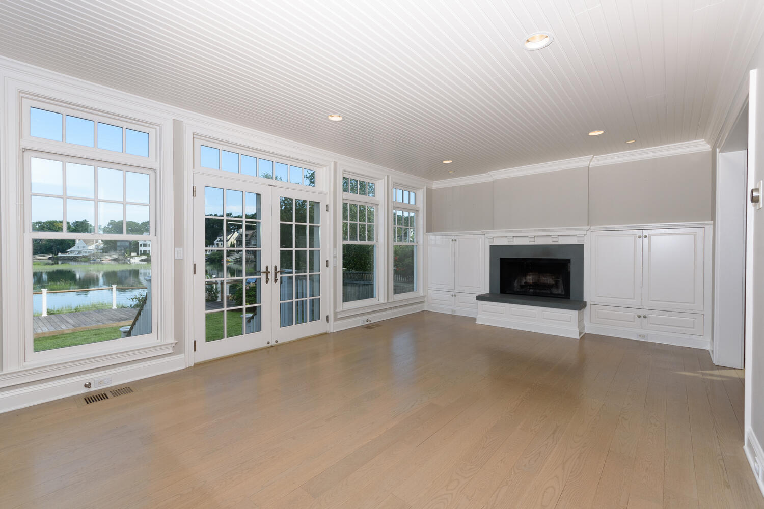 73 Roton Avenue Rowayton, CT 06853 - Photo 10 of 31 a view of an empty room with a fireplace and a window