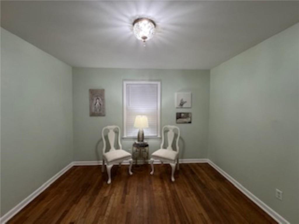 209 Moultrie Lane Southwest Rome, GA 30161 - Photo 43 of 46 a living room with furniture and a wooden floor