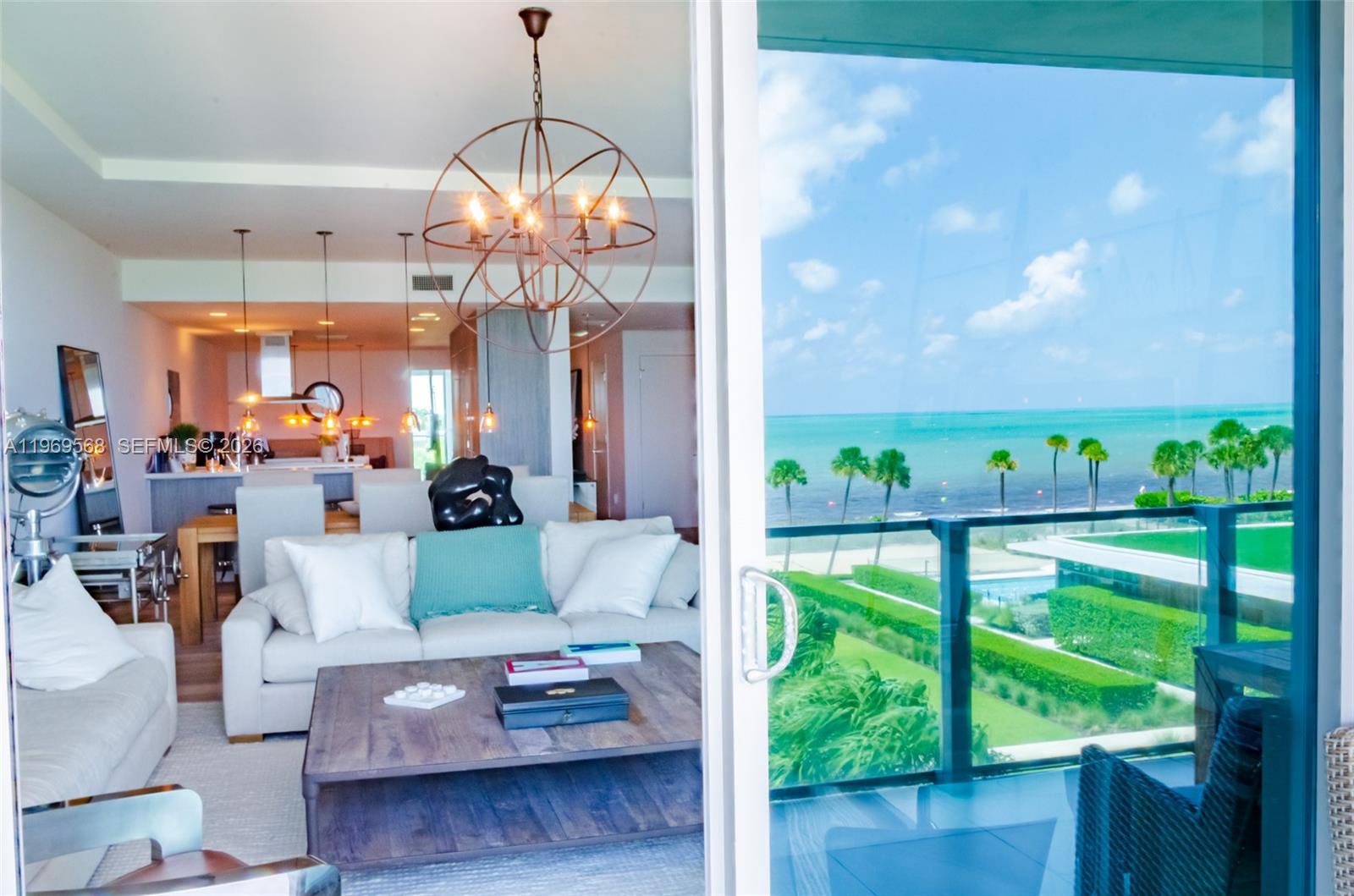 350 Ocean Drive, Unit 406N Key Biscayne, FL 33149 - Photo 24 of 41 a living room with furniture and a large window