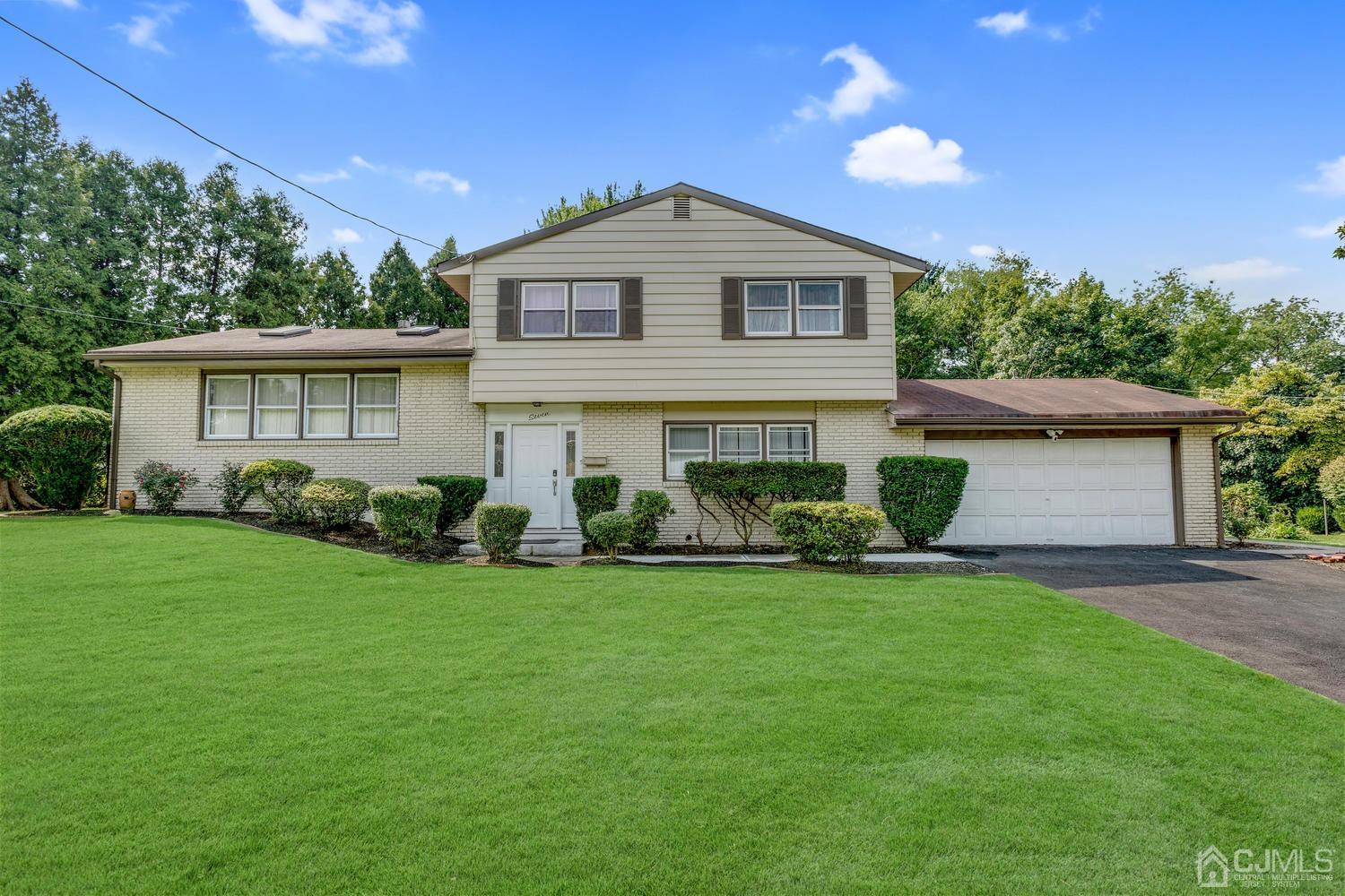 7 Colburn Road East Brunswick, NJ 08816 - Photo 1 of 25 a front view of a house with a yard