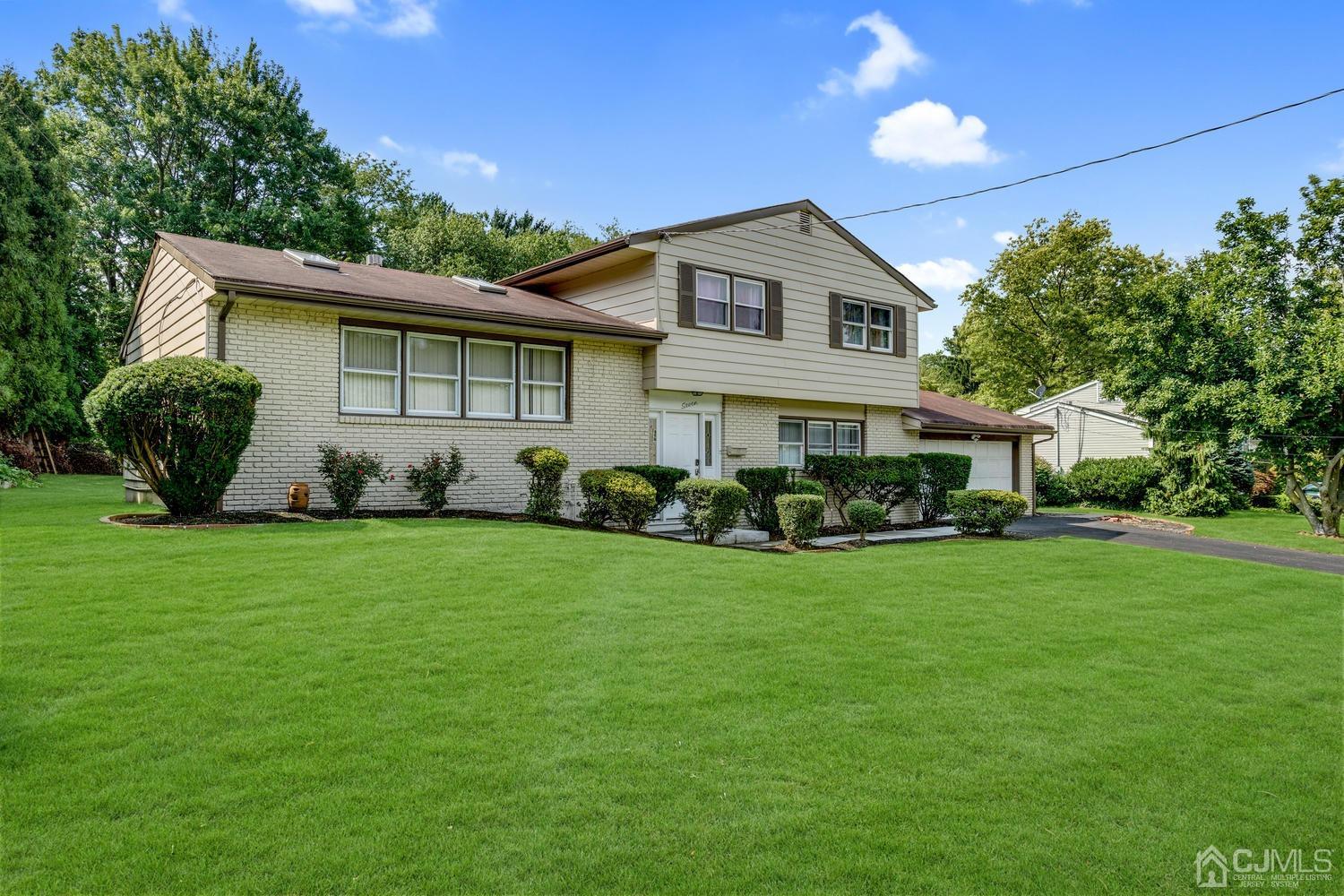 7 Colburn Road East Brunswick, NJ 08816 - Photo 2 of 25 a view of a house with backyard sitting area and garden