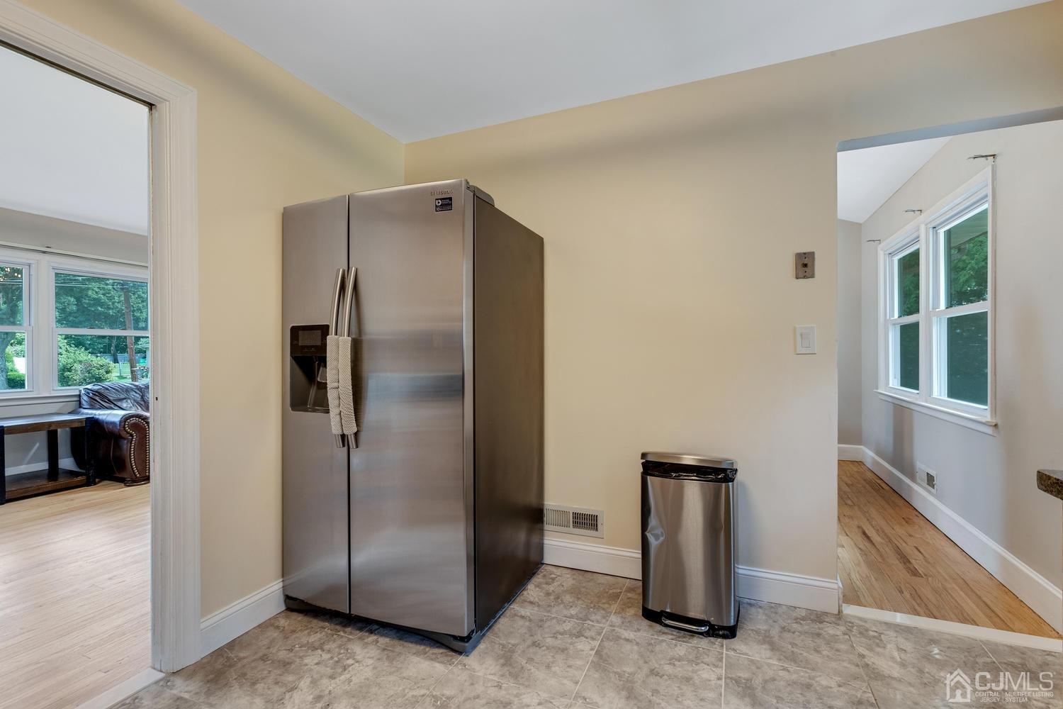7 Colburn Road East Brunswick, NJ 08816 - Photo 15 of 25 a view of a refrigerator in kitchen and an empty room