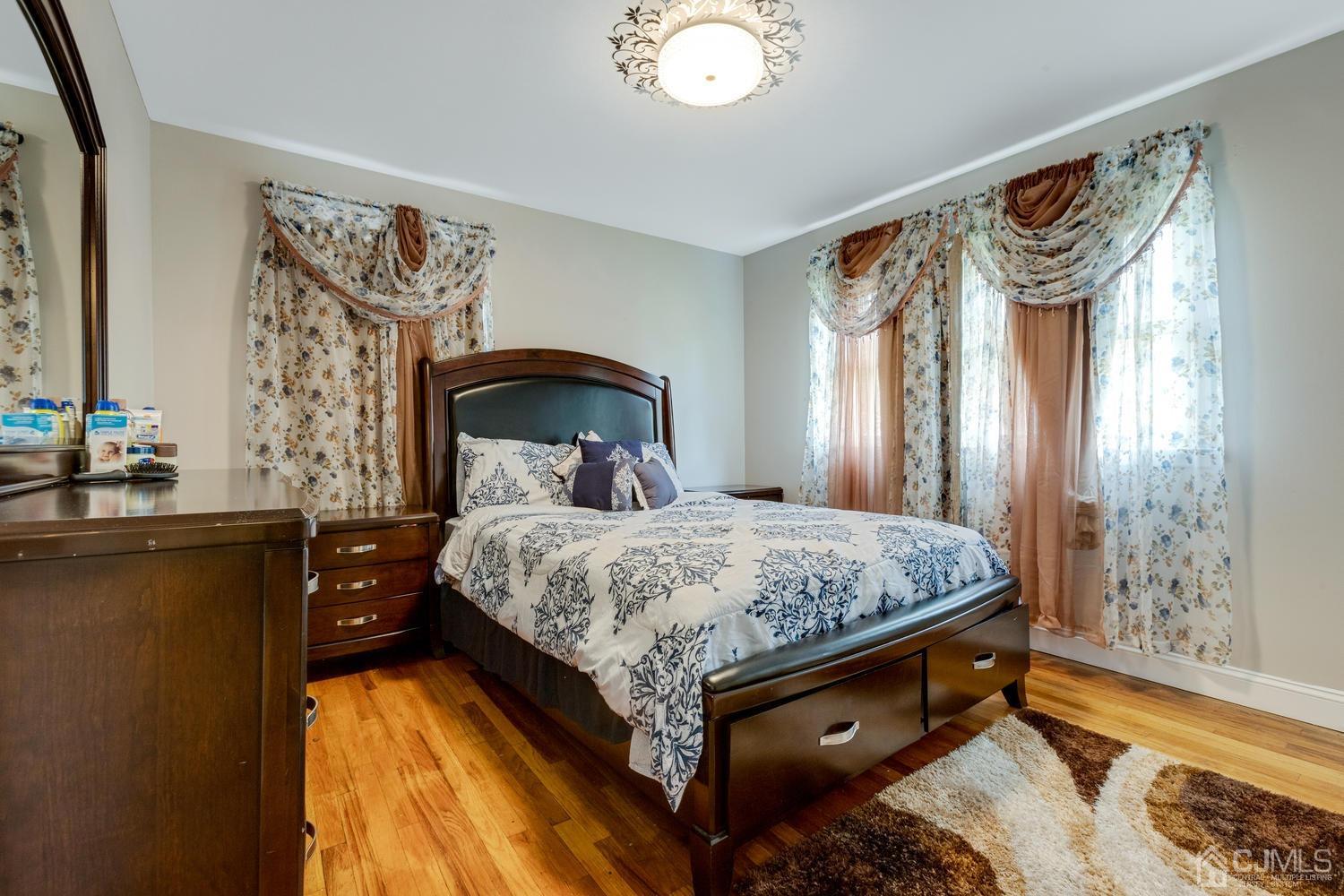 7 Colburn Road East Brunswick, NJ 08816 - Photo 19 of 25 a bedroom with a bed and a window
