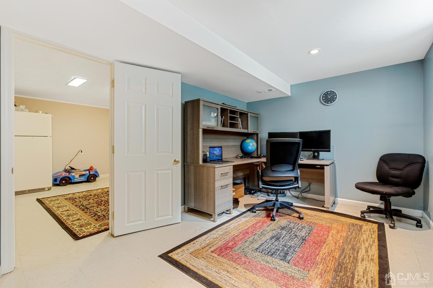 7 Colburn Road East Brunswick, NJ 08816 - Photo 22 of 25 a view of a workspace with furniture and a rug