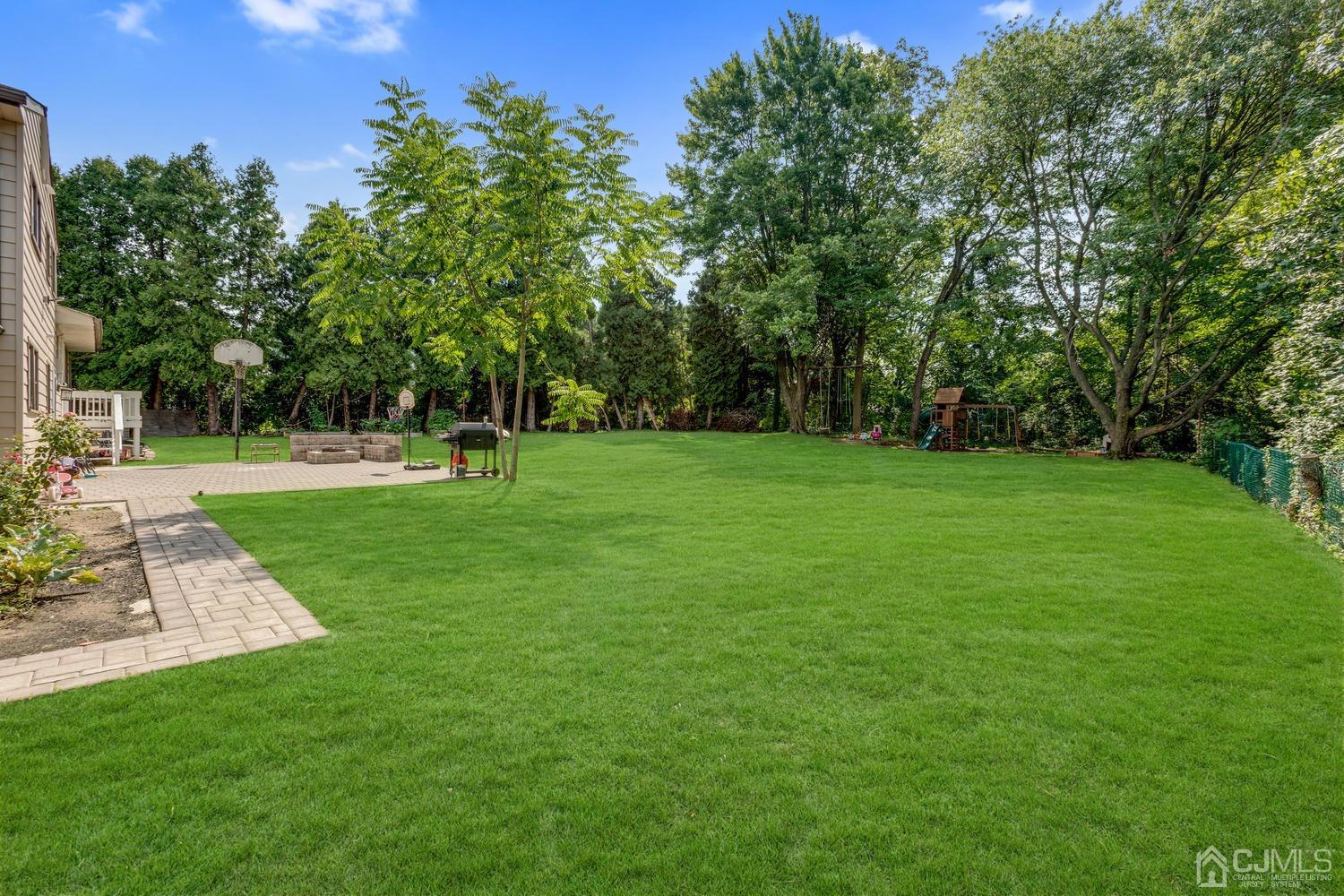 7 Colburn Road East Brunswick, NJ 08816 - Photo 23 of 25 a view of a grassy field with trees