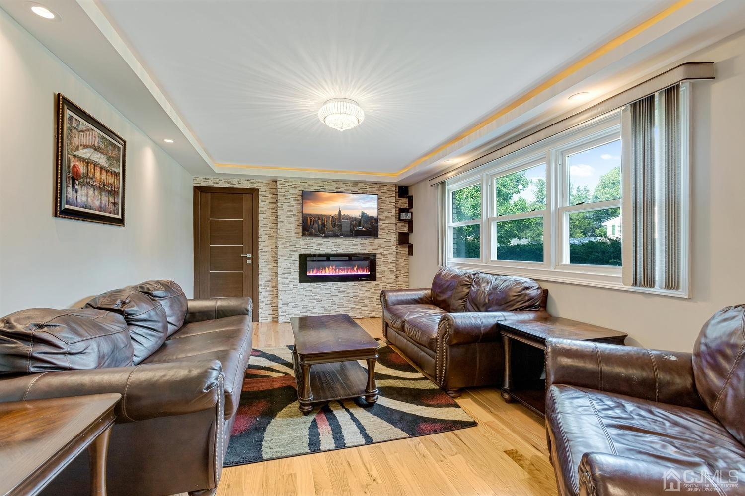 7 Colburn Road East Brunswick, NJ 08816 - Photo 6 of 25 a living room with furniture and a flat screen tv