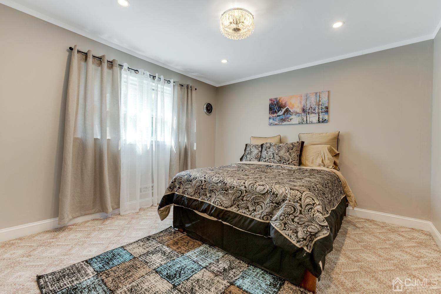 7 Colburn Road East Brunswick, NJ 08816 - Photo 7 of 25 a bedroom with a bed and a painting on the wall