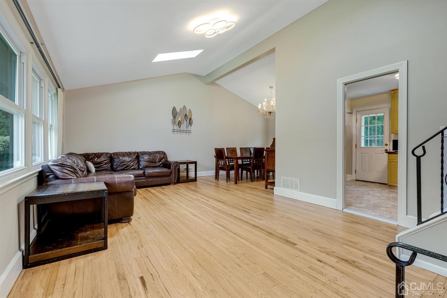 7 Colburn Road East Brunswick, NJ 08816 - Photo 9 of 25 a living room with furniture and a wooden floor