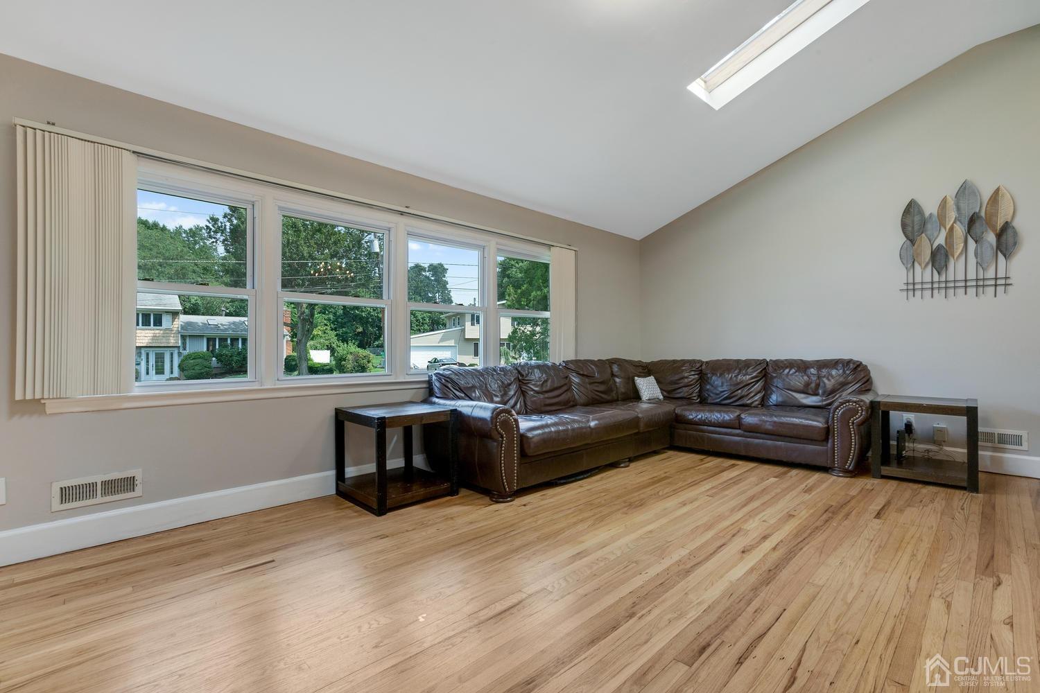 7 Colburn Road East Brunswick, NJ 08816 - Photo 10 of 25 a living room with furniture and a wooden floor